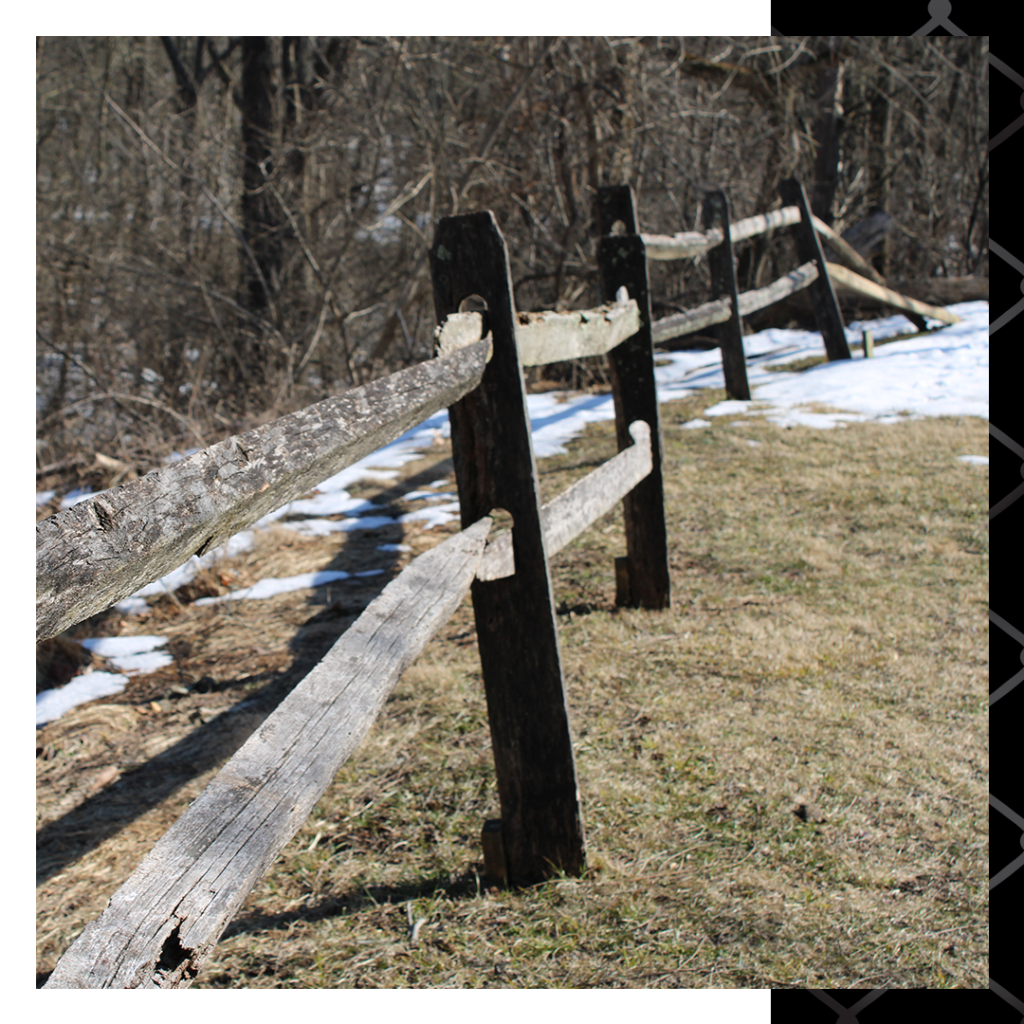 leaning wood slat fence