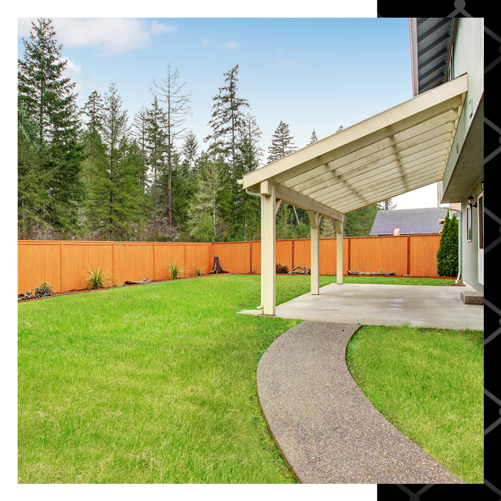 well-kept backyard with wood fence lining property line