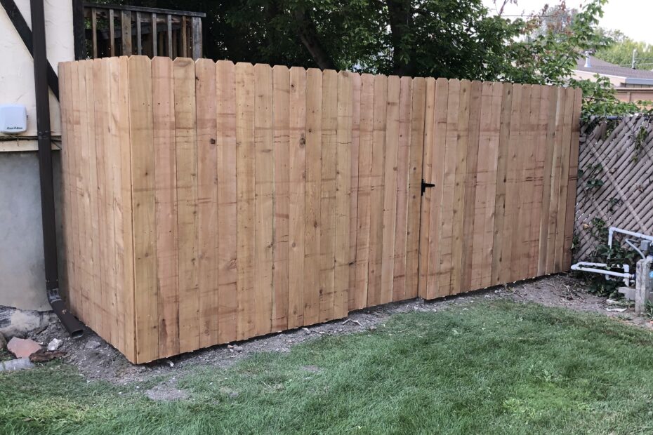 Cedar Dog Ear fence with a man gate